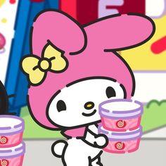 hello kitty is holding two plastic cups in her hand