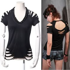 a female mannequin wearing shorts and a black shirt with cutouts on it