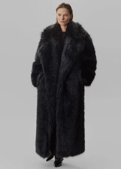 Joan Long Faux Fur Coat - Black – The Frankie Shop Formal Faux Fur Outerwear With Fur Trim, Black Long Faux Fur Coat, Black Faux Fur Coat For Work, Black Faux Fur Coat For Workwear, Formal Faux Fur Coat For Fall, Chic Faux Fur Coat With Pockets, Chic Black Fur Coat With Faux Fur Trim, Faux Fur Coat For Workwear In Mink Color, Faux Fur Mink Color Coat For Work