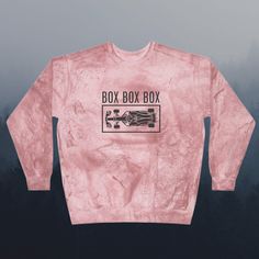 "Get ready to rev up your wardrobe with this stylish Formula 1 sweatshirt! Featuring F1 car graphic and the famous \"Box Box Box\" phrase in bold lettering, this comfortable crewneck sweater is perfect for wearing on race day or any other day you want to make a statement. The lightweight cotton blend fabric is soft and cozy for all-day wear, and the wide cut neckline and long sleeves provide a relaxed fit. Show off your love for the fast-paced world of Formula One with this must-have sweatshirt! Sports Crew Neck Sweatshirt With Screen Print, Formula 1 Merch, Formula 1 Shirt, Merch Aesthetic, F1 Car, Racing Club, Bold Lettering, F1 Racing, Fast Paced