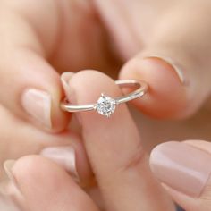 Our Tiny Kristian Moissanite Ring is the perfect stacking ring to add to your collection! It's perfect for everyday wear. Wear it by itself for a minimal look, or stack it with your other favorites. Details: Center stone Gemstone: Moissanite Stone Shape: Round Measurements: 4.00mm Band measurements: approx. 1.8mm wide, approx. 1.5mm thick The Kristian ring is also available in solid gold. Contact us for pricing. The Kristian ring is also available in other gemstones. Minimalist Diamond Crystal Ring With Vvs Clarity, Minimalist Open Diamond Ring In Diamond White, Minimalist Diamond White Open Diamond Ring, Minimalist Stackable Round Cut Diamond Ring, Everyday Silver Diamond Solitaire Ring, Delicate Everyday Rings With Brilliant Cut, Minimalist Stackable Diamond White Diamond Ring, Minimalist Sterling Silver Solitaire Diamond Ring, Minimalist Sterling Silver Diamond Ring With Vs Clarity