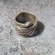 Sterling Silver Antiqued cast ring. One of a kind, millstone original. Unique Engraved Brass Rings, Engraved Brass Rings, Hand Cast Brass Ring, Antique Bronze Hand Cast Ring, Hand Forged Bronze Ring Jewelry, Hand Forged Bronze Ring, Hand-cast Bronze Round Ring, Unique Bronze Open Ring, Unique Bronze Rings For Anniversary