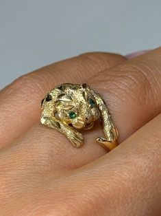 14K YELLOW GOLD EMERALD PANTHER  RING SIZE 7 RING WEIGHT: 4.8 g Main Stone: Emerald Main Stone Color: Green Main Stone Shape: Round Main Stone Width: 2 mm Main Stone Length: 2 mm Number of Gemstones: 2 Vintage: No Panther Ring, Ring Size 7, Rings Statement, Panther, Halloween Shopping, Stone Color, Statement Rings, Emerald, Jewelry Rings