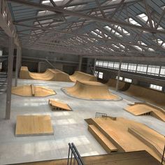 an empty skateboard park with ramps and stairs