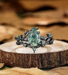 a green ring sitting on top of a piece of wood