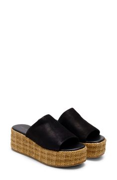 A woven raffia platform enhances the earthy vibes of this breezy and versatile sandal. 1 1/2" heel; 1" platform Synthetic upper/leather lining/synthetic sole Imported Summer Beach Leather Platform Slippers, Leather Platform Slippers For Beach In Summer, Leather Platform Slippers For Summer Beach, Summer Leather Platform Slippers With Textured Footbed, Leather Platform Slippers With Textured Sole For Summer, Comfortable Straw Platform Wedge Sandals, Beach Leather Platform Slippers With Cushioned Footbed, Beach Platform Slippers With Cushioned Leather Footbed, Beach Platform Slippers With Textured Sole And Wedge Heel