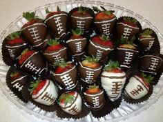 chocolate covered strawberries are arranged in a bowl