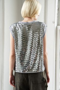 A sequin top with round necklineDetails:Self : 100% PolyesterSize & Fit- Model is 5`9" And Wearing Size Small- Measurements Taken From Size Small- Approx. Length: 23" Fall Party T-shirt With Sequins, Fall Contrast Sequin Crew Neck Top, Fall Crew Neck Top With Contrast Sequin, Contrast Sequin Crew Neck Top For Party, Metallic Sequin Top For Night Out, Party Crew Neck Top With Contrast Sequin, Sequin Crew Neck T-shirt, Glamorous Crew Neck Tops For Night Out, Glamorous Crew Neck Summer Tops