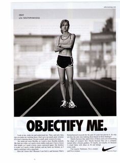 a woman is standing on a running track