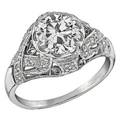 an antique style diamond engagement ring in white gold