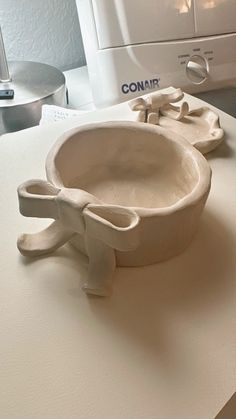 a white bowl sitting on top of a counter