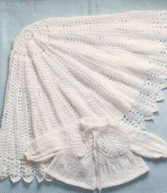 a white crocheted doily with lace on it