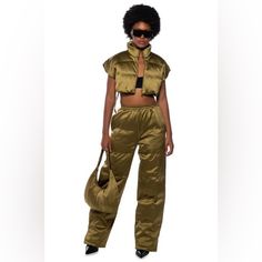 Nwt:Akira Peri Peri Wide Leg Puffer Pant In Olivesz; Mediumthe Akira Label Peri Peri Wide Leg Puffer Pant In Olive Is Made From A Smooth, Non-Stretch Puffer Fabrication And Features A High Rise Waist, A Shirred Elastic Toggle Drawstring Waistband, Slant Side Pockets, Slick Polyester Lining, A Wide Leg Silhouette, And Velcro Ankle Cinchers. Style This Piece With The Coordinating A Long Sleeve Sweater, And Booties For An Ideal Look. - 100% Polyester - Hand Wash Or Dry Clean - Imported Peri Peri, Olive Color, Drawstring Waistband, Sleeve Sweater, Long Sleeve Sweater, Pant Jumpsuit, Puffer, Wide Leg, High Rise