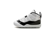 The Air Jordan 11 Crib “Gratitude” is the infant sizing of the Holiday 2023 Air Jordan 11 release.  Also nicknamed the “Defining Moment Pack” or simply “DMP” colorway, the Jordan 11 “Gratitude” is based on the retro basketball sneaker’s original “Concord” colorway that was worn by Jordan with the Chicago Bulls throughout the team’s historic run during the 1995-96 NBA season.  The upper features a white ballistic mesh construction with white leather appearing on the heel.  A glossy black patent l Jordan 11 Gratitude, Win Like 82 Jordan 11, Jordan 11 Concord Bred, Air Jordan 11 Cmft, Jordan 11 Concord, Retro Basketball, Nba Season, Air Jordan 11, Basketball Sneakers