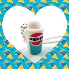 a pepsi cup shaped like a heart on a chain