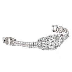 For Sale on 1stDibs - This particular piece is a perfect example of Art Deco craftsmanship and elegance! The bracelet is designed in platinum as an openwork panel that graduates Art Deco Diamond Jubilee Bracelet, Art Deco Platinum Diamond Bracelet, Formal Art Deco Diamond Tennis Bracelet, Art Deco Platinum Tennis Bracelet With Diamond Accents, Luxury Platinum Diamond Bracelet With Accents, Luxury Platinum Diamond Bracelet With Diamond Accents, Art Deco White Gold Jubilee Diamond Bracelet, Art Deco White Gold Diamond Bracelet With Brilliant Cut, Formal Art Deco Brilliant Cut Tennis Bracelet