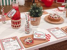 a table topped with pizza and other items