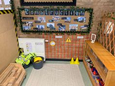 a bulletin board with construction written on it and some bins in front of it