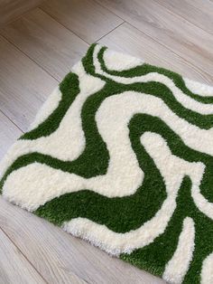 a green and white rug on the floor