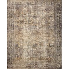 an antique style rug in beige and brown tones with a faded design on the bottom