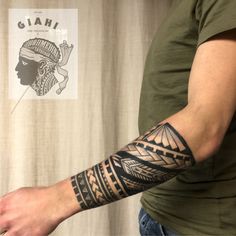 a man with a tattoo on his arm