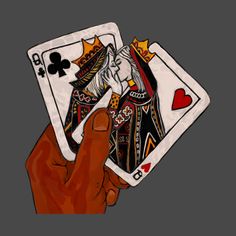 a hand holding two playing cards in front of a black background with the king and queen