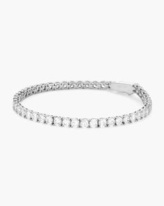 We are pleased to introduce you to our silver Tennis Bracelet—serving classic luxury with stunning simulated diamonds handset in a silver chain. Made to be worn for every occasion. Classic White Sterling Silver Bracelet With Diamond Accents, Silver Diamond Tennis Bracelet For Everyday Luxury, Classic Sterling Silver Tennis Bracelet, Classic Sterling Silver Bracelet In Diamond White, Classic Silver Cubic Zirconia Tennis Bracelet, Classic Sterling Silver Chain Bracelet With Diamond Accents, Classic Diamond White Sterling Silver Bracelet, Dazzling Silver Bracelets With Brilliant Cut, Classic White Bracelets For Everyday Luxury