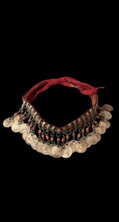 This exquisite necklace choker is a genuine antique piece from the 1880s and features a silver Ottoman monogram coin. The necklace is handmade with great attention to detail and the choker style adds elegance to any outfit. The type of necklace/locket is a classic coin design and the main stone is a beautiful coral in silver color. This piece is perfect for antique jewelry enthusiasts who appreciate the art and history of jewelry making. The items I sell are not new, they are vintage or antiques Vintage Medallion Coin Necklace, Vintage Silver Coin Necklace, Vintage Silver Coin Necklace For Festivals, Antique Silver Vintage Jewelry For Festivals, Vintage Antique Silver Jewelry For Festivals, Vintage Medallion Jewelry For Festival, Vintage Medallion Jewelry For Festivals, Silver Vintage Charm Necklace For Festival, Silver Coin-shaped Jewelry For Ceremonial Occasions