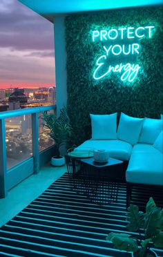 a couch and table on a balcony with the words protect your energy written above it