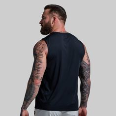 Our men's black muscle tank is built for your most demanding warm-weather workouts. Advanced BP Shield Technology pulls excess moisture away from the skin to keep you cool while odor-control technology keeps this black workout tank top smelling fresher for longer when things start heating up. And if you’re taking your workout outside, the UVA & UVB protection repels the sun’s harmful rays so you can stay focused on giving it your all. Black Sleeveless Muscle Tee For Gym, Sporty Black Muscle Tee For Summer, Black Crew Neck Workout Vest, Black Crew Neck Vest For Workout, Black Muscle Tee For Summer Sports, Black Muscle Tee For Summer Workouts, Black Breathable Sportswear Tank Top, Breathable Black Sportswear Tank Top, Black Crew Neck Tank Top For Gym