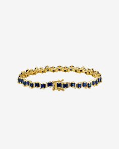 Experience the vibrant beauty of the 'Princess' Collection with this exquisite handcrafted 18-karat gold tennis bracelet from SUZANNE KALAN. Set with 7.80 carats of stunning princess cut dark blue sapphires, and alternating baguette white diamonds, this bracelet is a true masterpiece of luxury and sophistication. The timeless design of the bracelet makes it a versatile accessory that can be easily paired with any outfit, whether dressing up or dressing down. Details 18k white gold, yellow gold o Luxury Sapphire Jewelry With Baguette Diamonds, Classic Sapphire Jewelry With Baguette Diamonds, Luxury Gold Sapphire Tennis Bracelet, Yellow Gold Sapphire Jewelry With Baguette Diamonds, Sapphire Tennis Bracelet, Gold Tennis Bracelet, Suzanne Kalan, Princess Collection, Baguette Diamond