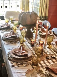 a dining room table set for thanksgiving dinner