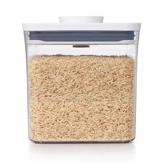 rice in a glass container on a white background