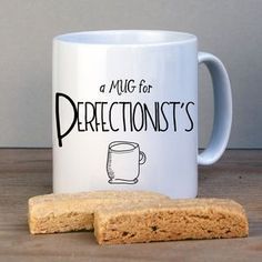 a mug for prerectionists and two pieces of biscuit