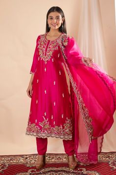 Fuchsia pink kurta with floral pearl, sequin and tassel embroidery and a scalloped hem. Paired with a pant and scallop embroidered dupatta. - Aza Fashions Pink Silk Sets With Mirror Work, Pink Silk Embellished Sets, Embellished Pink Silk Sets, Pink Embellished Silk Sets, Pink Gota Work Salwar Kameez For Reception, Pink Salwar Kameez With Gota Work For Reception, Pink Silk Embellished Kurta, Pink Silk Set With Dabka Work, Fitted Pink Raw Silk Dupatta