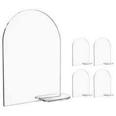 a set of four clear acrylic display stands with curved bases and oval shelves