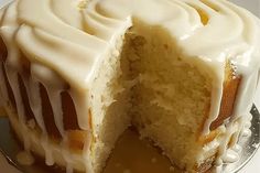 a cake with white frosting on a plate