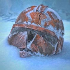 a helmet that is sitting in the snow