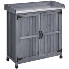 a gray wooden cabinet with two doors