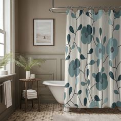 a bathroom with a bathtub, shower curtain and rugs in the flooring