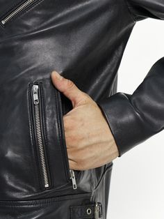 This Luis Lambskin Biker Jacket brings together traditional craftsmanship with a modern look. High-quality leather and four side zip pockets make this jacket perfect for the modern man. The classic look is updated with a zipped sleeve, offering a timeless style crafted with care and attention. Color- Pitch Black Nickel finish YKK hardware Polyester interlining Two Inside Pockets Five front pockets with a zipper Fit: Regular Used Materials Shell: Genuine Lambskin Lining: High-quality polyester Th Pitch Black, Modern Man, Nickel Finish, Biker Jacket, High Quality Leather, Timeless Style, Classic Looks, Side Zip, Inside Pocket