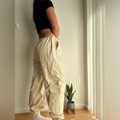 Asos Cargo Pants - Size Us 8 Like New! - No Tags But Never Worn - Cream,Tan Color Great Basic To Go With Any Fit - Cinched Waist And Bottoms Which Are Adjustable Cream Utility Bottoms With Cargo Style, Cream Cotton Cargo Bottoms, Cream Utility Cargo Bottoms, Cream Utility Cargo Style Bottoms, Casual Cream Cargo Pants, Beige Utility Trousers, Beige Cargo Style Tapered Leg Pants, Beige Long Pants With Side Pockets, Casual Cream Bottoms With Side Pockets