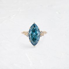 Product photo of One of a Kind 14k Yellow Gold 4.2ct. Marquise-cut Blue Diamond Snowdrift Engagement Ring featuring accent diamonds|14k Yellow Gold Snowdrift Ring, Band Drawing, Blue Diamond Wedding Ring, Unusual Engagement Rings, Melanie Casey, Winter Window, Drawing Eyes, Falling Snow, Basket Setting