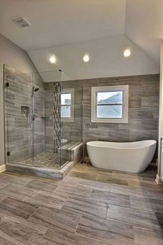 a bathroom with a tub, sink and shower in the middle of it's floor