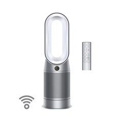 an air purificater next to a remote control on a white background