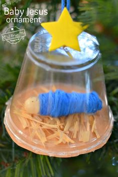 an ornament hanging from a christmas tree with a blue thread wrapped around it