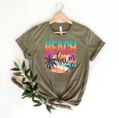 "Beach Bum Shirt, Beach Graphic Shirt, Beach Bum T-Shirt, Summer Vacation T-Shirt, Summer Beach Shirt, Beach Fun Tee, Funny Beach Shirts ☀️☀️☀️☀️☀️ Everything in our shop is hand crafted and made to order. If you want different color or size contact me! If you would like something custom made to fit your personal style please message me and I will do everything to get you that something special. ---How To Order--- ⭐️Please, check and review all photos ⭐️Choose your t-shirt size and color ⭐️Enter Green Letter Print T-shirt For Vacation, Tropical Relaxed Fit T-shirt For Beach Season, Screen Print T-shirt For Beach Vacation, Vacation Green Shirt With Graphic Print, Green Graphic Print Vacation Shirt, Vacation Green Graphic Print Shirt, Green Graphic Print Shirt For Vacation, Green Short Sleeve T-shirt For Beach Season, Fun Green T-shirt For The Beach