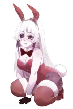 a woman in bunny ears sitting on the ground