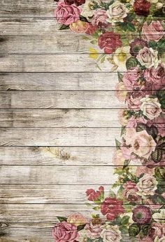 an old wooden background with flowers on it