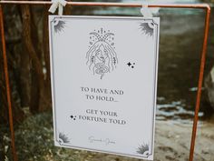 a sign that says to have and to hold get your fortune told hanging on a gate